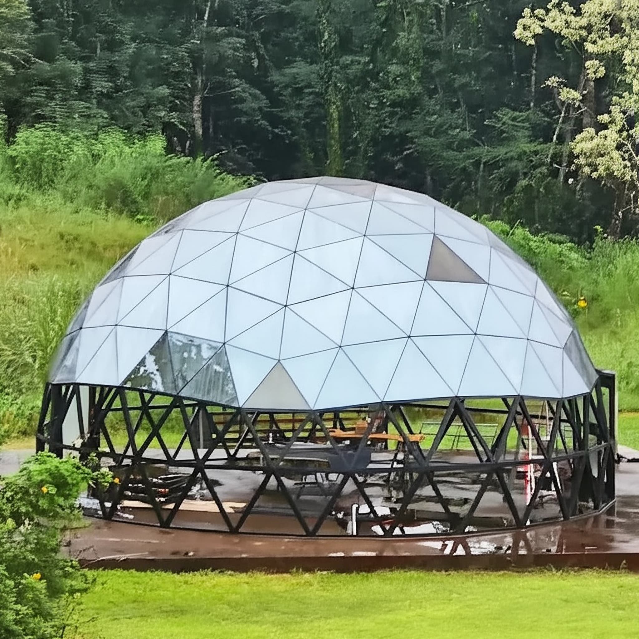 Glass geodesic dome in the landscape
