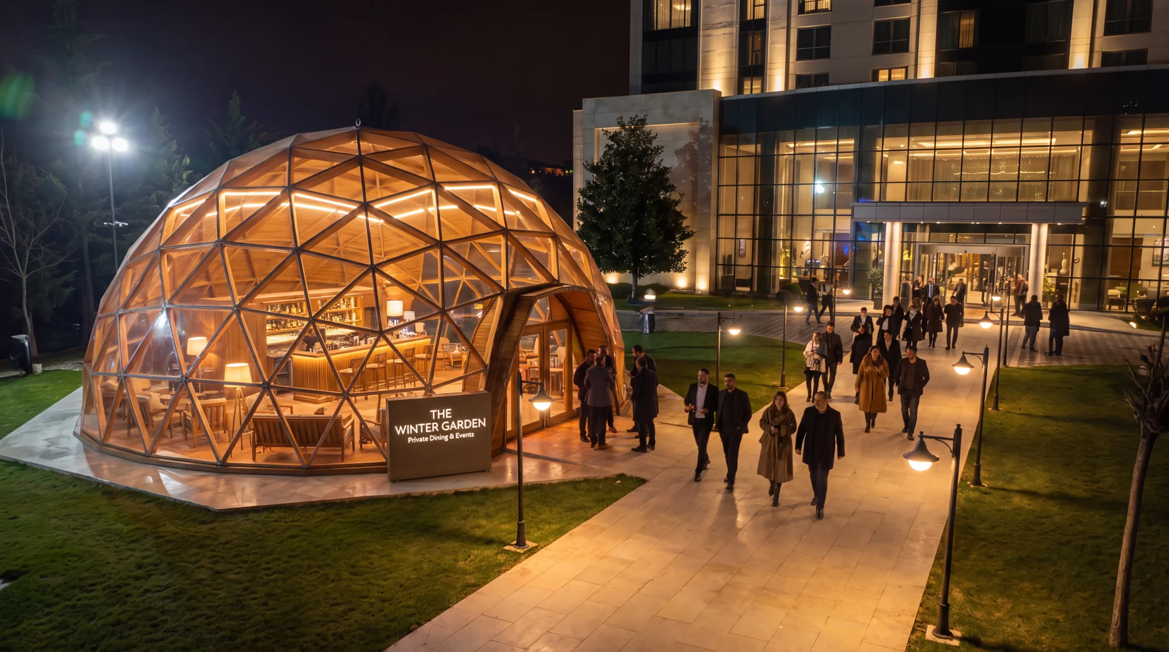 The Winter Garden event dome lit at night outside a hotel