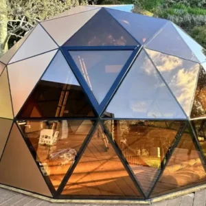 Hybrid geodesic dome house kit with glass and insulated panels. Perfect for glamping, Airbnb, or eco-resorts. Built to last by The Dome House.